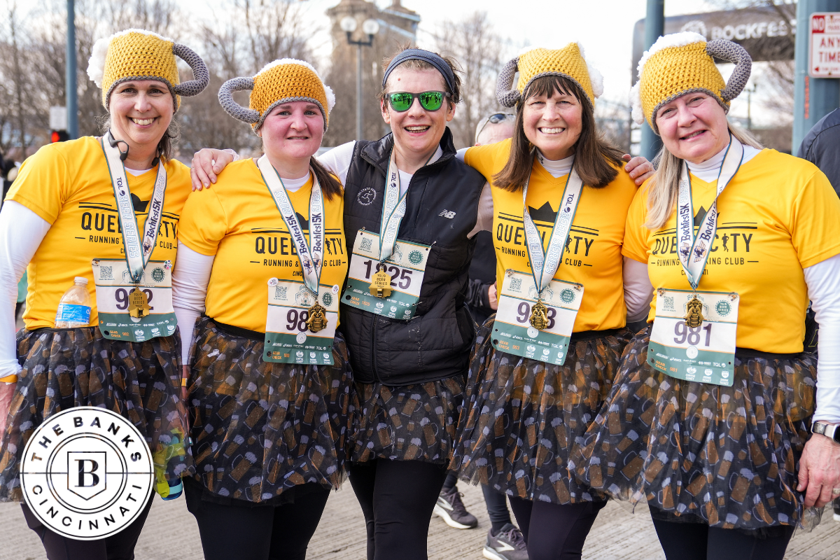 a group of participants dressed in beer-themed apparel posing for a photo
